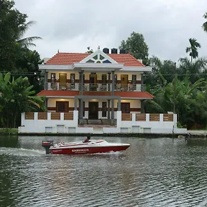Mango Kerala Homes בית אירוח קומרקום